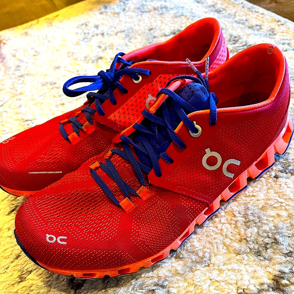 On Running Red and Blue Athletic Shoes